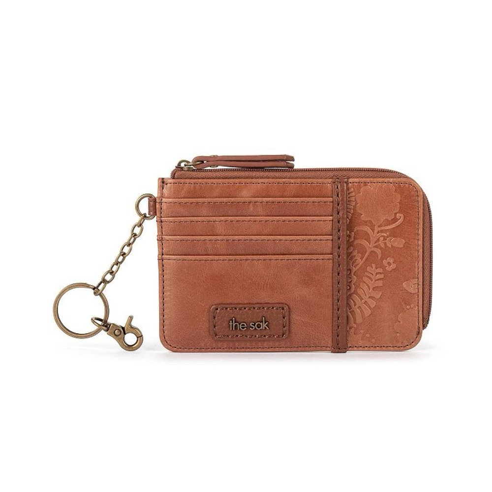 The Sak Iris leather card wallet in brown with floral embossing.